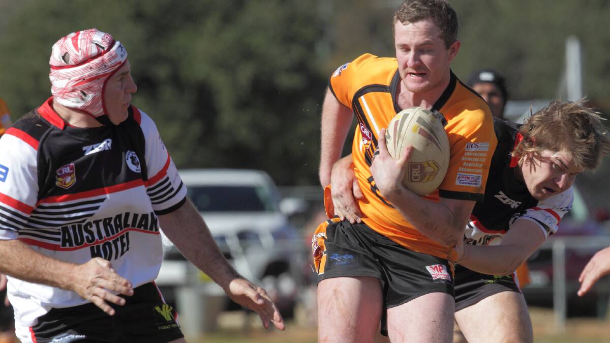 GONE BUT HOPEFULLY BACK: Burrangong players tackle their Canowindra opponent during the 2018 Woodbridge Cup season. The Bears have folded a couple of weeks out from round one. Photo: RS WILLIAMS
