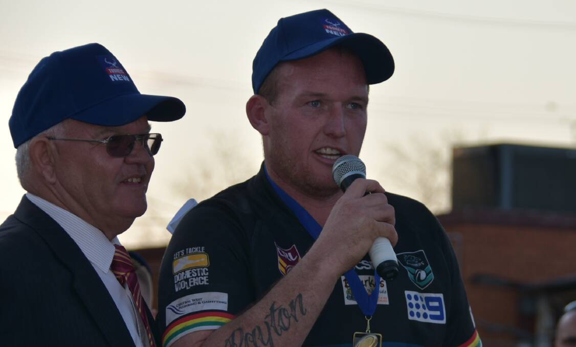 BROUGHT TO TEARS: Brent Seager accepts the Dave Scott medal on Sunday. 
