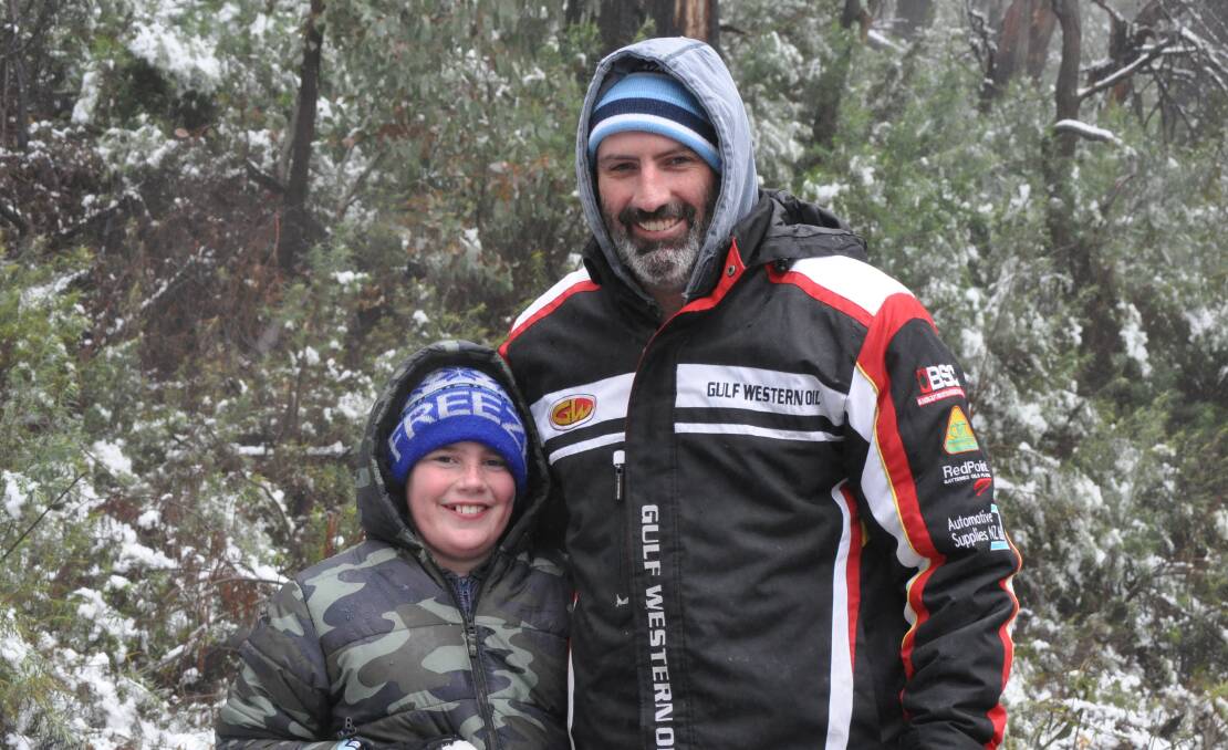Ben and Brian Mulhall at last week's snowfall on Mount Canobolas. Photo: NICK McGRATH