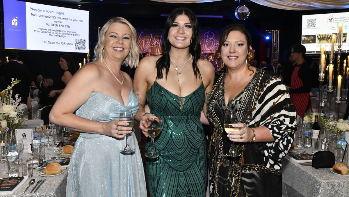 Carmel Wilkins, Georgie Drain, Hayley Wheeler at the 2023 Ronald McDonald House charities ball. Picture by Jude Keogh