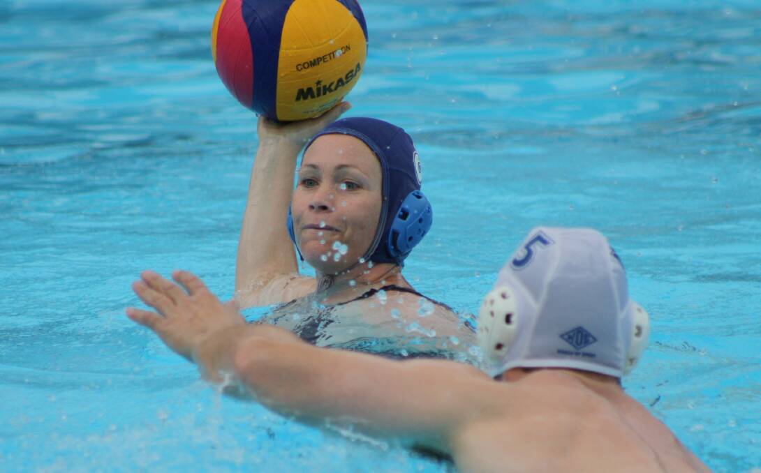 Goal Diggers' Jo Morrison needs a quick option as the Team Platypus defence closes in. Photo: MICHELLE COOK 1203mcwpolo4