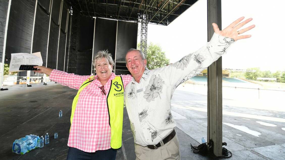  HANDS IN THE AIR: Bathurst councillor Jacqui Rudge and mayor Bobby Bourke on the Carrington Park stage that Sir Elton John will walk out onto for his concert tomorrow night. Photo: CHRIS SEABROOK 012020celton3