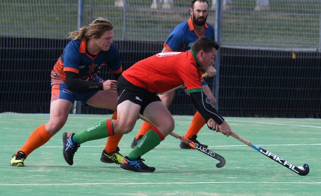 FAST START: Nic Milne netted a goal during Lithgow Storm's 11-0 thrashing of Orange Wanderers. They sit first on the men's PLH table. Photo: JUDE KEOGH