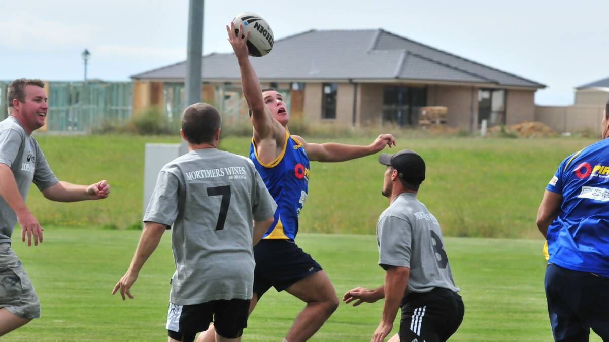 IN ACTION: Mortimer and then CYMS coach Mick Sullivan (hat) during a game of touch in 2011. Photo: JUDE KEOGH