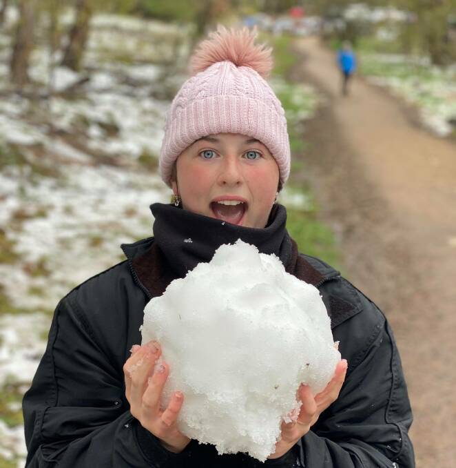 SNOW FUN: Jasmine Palmer made this giant snowball at Pinnacle on Saturday morning. Photo: LEANNE PALMER