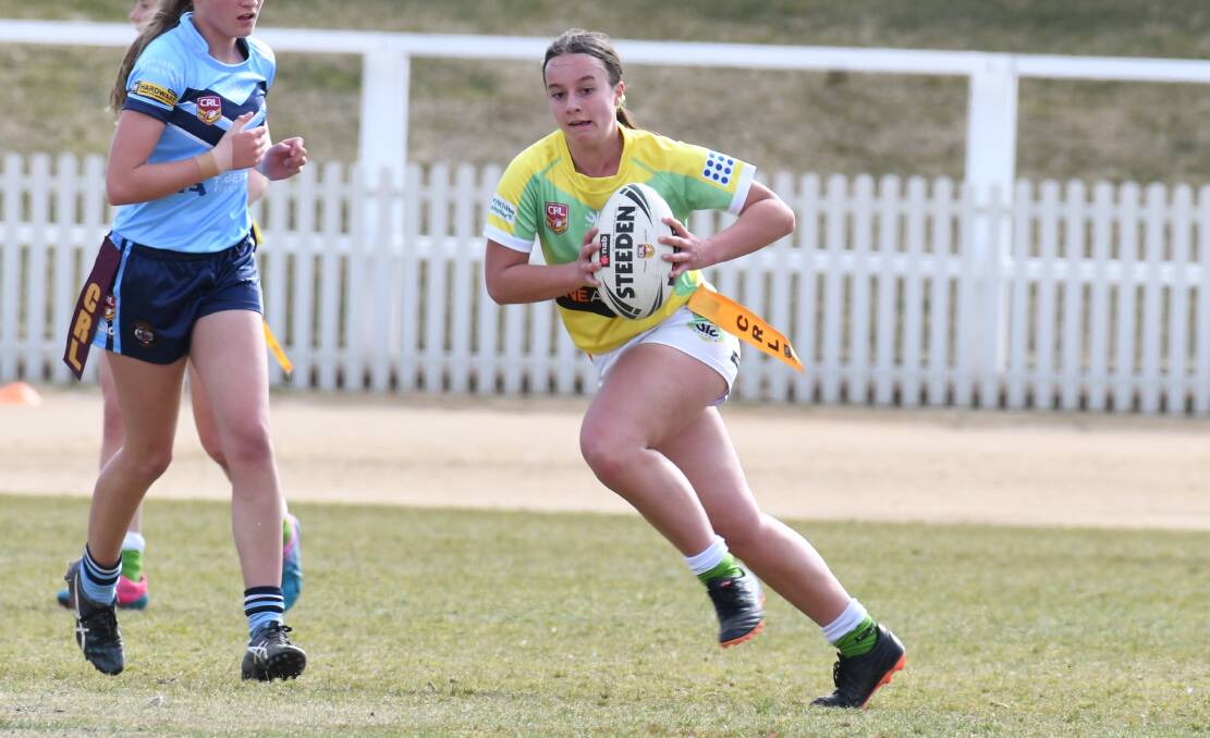 IN THE CLEAR: Keely Prevett charges the ball forward for CYMS' under 18s league tag side. Photo: CARLA FREEDMAN