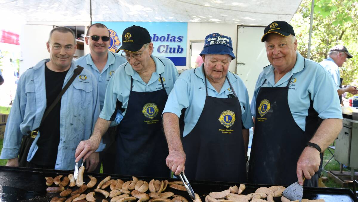 AUSTRALIA DAY: Orange Canobolas Lions Club members Robert Etienne, Brett Campbell, Bob Fabry, Bill McAuliffe, Phil Baker at the barbecue at Cook Park in 2019. Photo: JUDE KEOGH