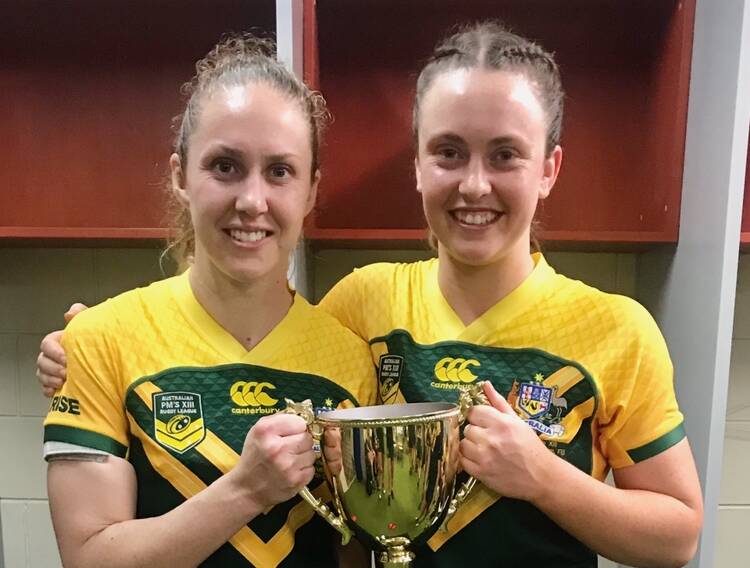 LEADING THE WAY: Prime Minister's XIII skipper Karina Brown and Orange's Kaitlyn Phillips after their win in Fiji. Phillips says Brown's leadership was invaluable throughout the week on tour. Photo: CONTRIBUTED 