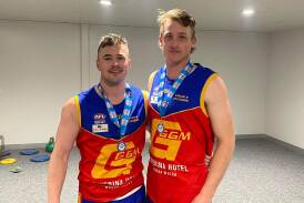 Michael Rothnie and and fellow Central West product Mitch Taylor with their Riverina League premiership medals. Picture supplied.