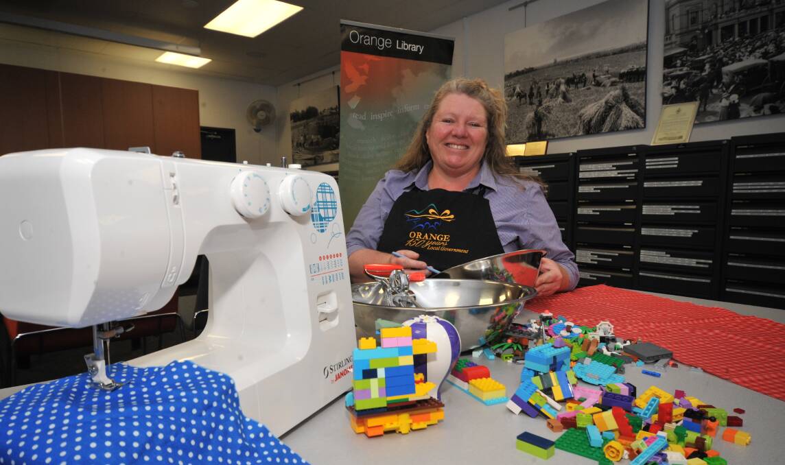 FUN AND GAMES: Emma Flemming with some of the equipment and toys children will get to use in the school holiday workshops. PHOTO: JUDE KEOGH