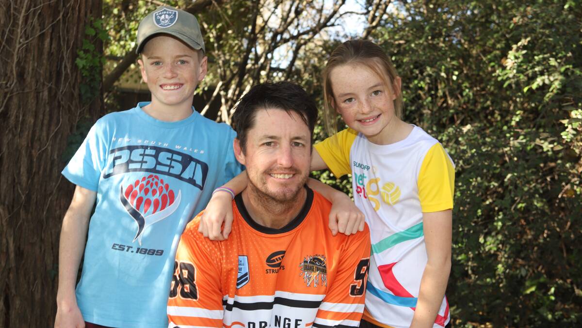 SPEAK UP: Sam, Wayne and Tess Hill are are taking on the push-up challenge for headspace Orange. Photo: CARLA FREEDMAN