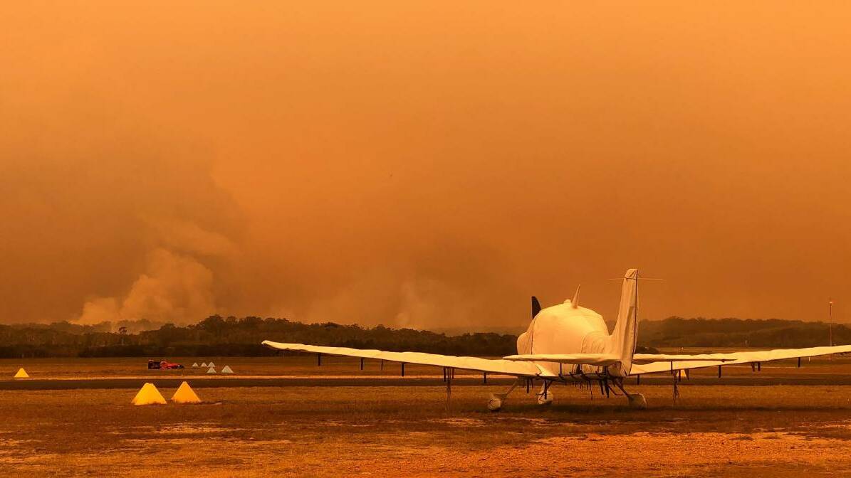 RED ALERT: Extreme fire conditions are forecast for Orange and surrounds on Monday and Tuesday, while catastrophic fire conditions are tipped for the coming days on the north coast, which will add to this view from Port Macquarie Airport. Photo: Amanda Leech