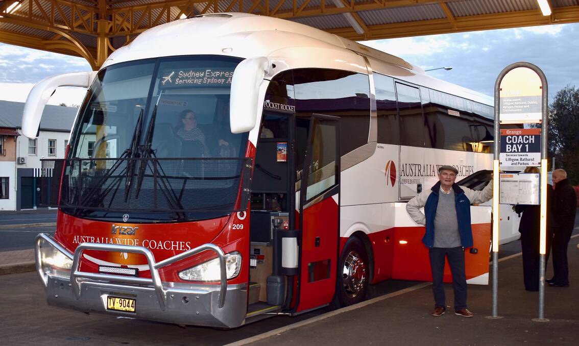 Orange Rail Action Group chairman Dr Peter Bilenkij at Orange railway station with the first bus in 2019. Photo: Supplied