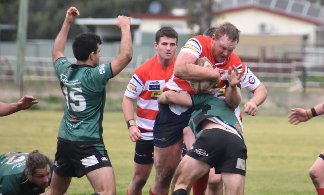 BANG: Blake Tidswell charges the ball up for Cowra in Saturday's massive, minor premiership winning victory over Orange Emus. Photo: ANDREW FISHER
