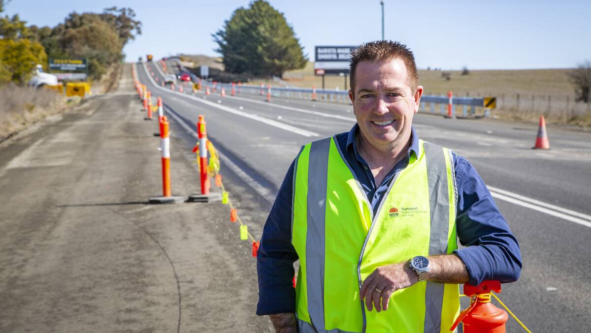 WORK DONE: Minister for Regional Transport and Roads Paul Toole at the 1.3 kilometre section of the Mitchell Highway set for completion by the end of the week. Photo: CONTRIBUTED 