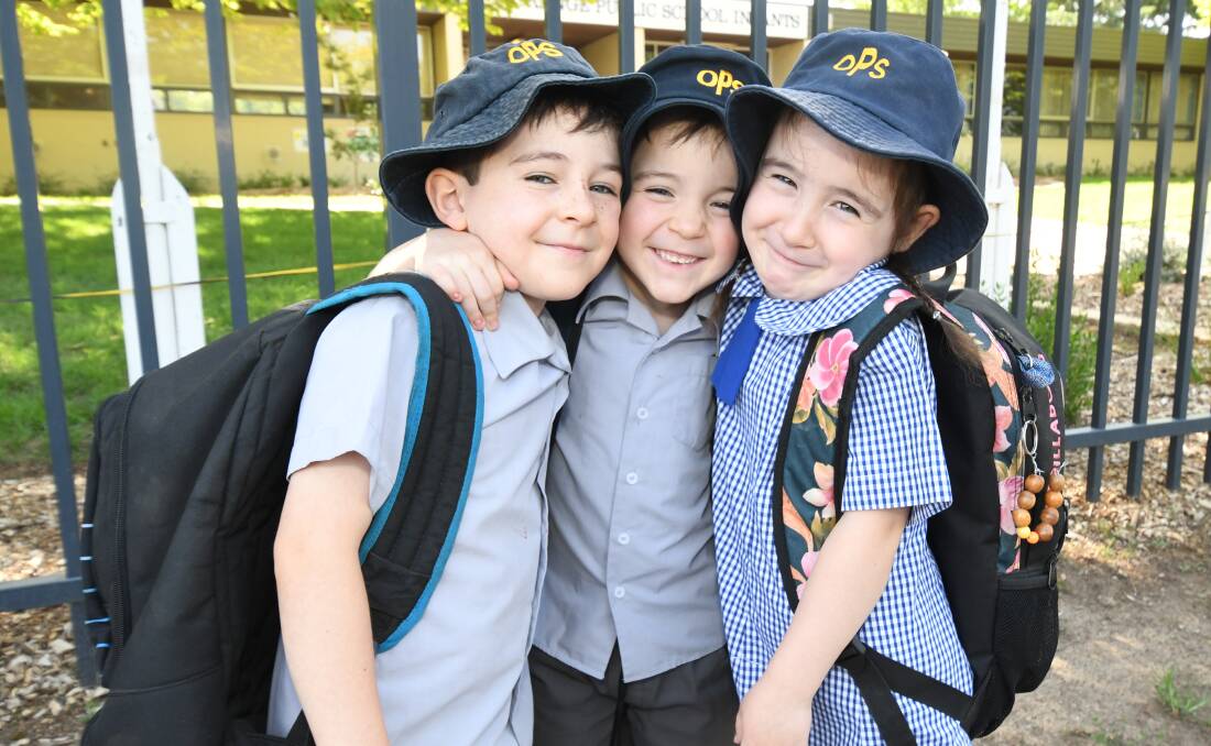 BIG SCHOOL READY: From left, Roarke, Knox and Jocelyn Menzies at Orange Public School. Twins, Knox and Jocelyn join their big brother at OPS in 2020. Photo: JUDE KEOGH