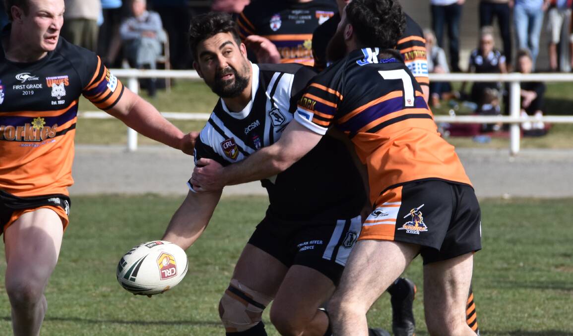 OUT THE BACK: Claude Gordon attempts an offload in the Magpies semi-final loss to Lithgow. The Cowra club will hold a meeting on Wednesday to address the club's future. Photo: CIARA BASTOW