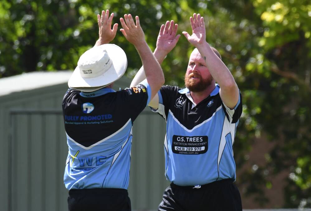 HIGH FIVES: Dave Henderson celebrates a wicket for City Colts at Riawena Oval on Saturday. Photo: JUDE KEOGH