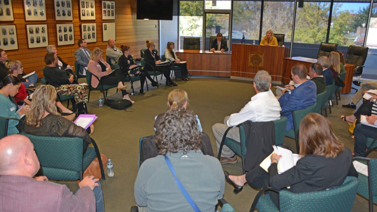 MEETING: Minister for Mental Health Bronnie Taylor chairs the roundtable meeting at Orange City Council's chambers on Friday afternoon. Photo: ALLAN REEDER
