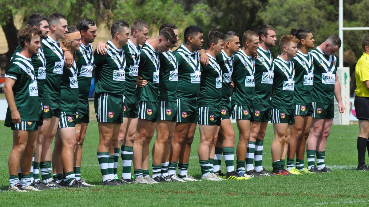 ARM IN ARM: Western paid tribute to division legend Steve 'Bear' Hall at Parkes on Sunday, wearing black arm bands and taking part in a moment's silence. Photo: NICK MCGRATH