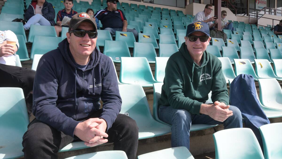 EXTRA SEATING: Andrew Lotherington, Garry Mugridge in the wade Park grand stand during last Saturday's semi-final. Photo: JUDE KEOGH