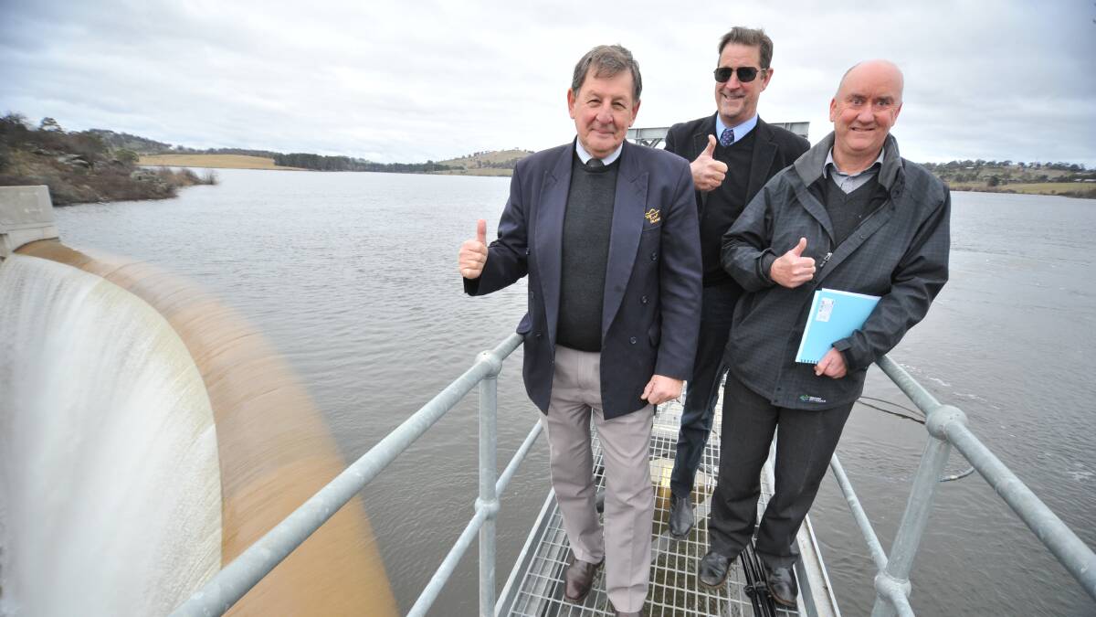 Then Orange mayor Reg Kidd, Council CEO David Waddell and Water and Sewerage Strategic Manager Wayne Beatty at the Suma Park dam wall in 2021 when it filled after the drought ended during 2020. Picture by Carla Freedman