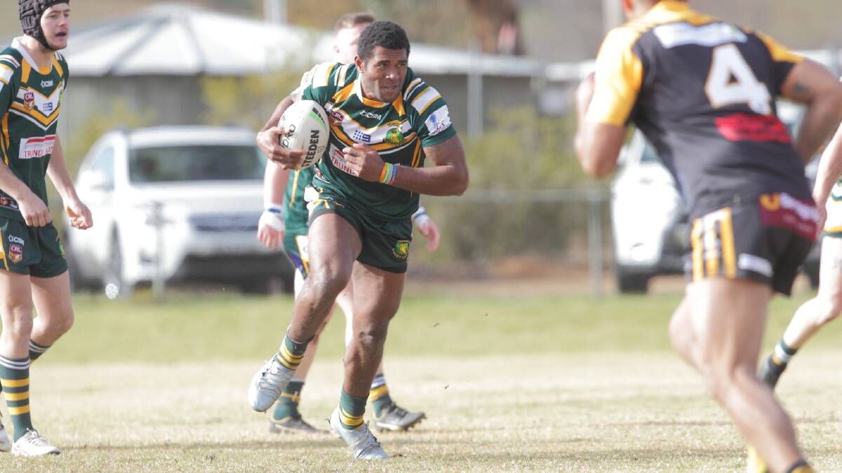 HERE WE COME: Trundle's Villitati Baba charges the ball forward for the Boomers. Photo: RS WILLIAMS