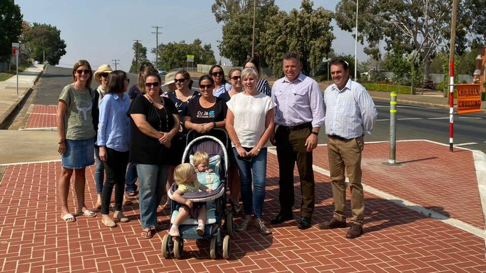 CROSSING: Phil Donato with members of the Canowindra community campaigning for a new crossing on the highway. 