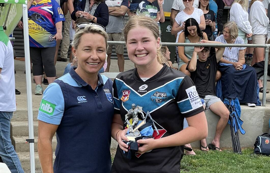 BLUE TO THE BONE: NSW Origin player Kylie Hilder and Vipers under 18s gun Lilly Baker, pictured after being awarded player of the grand final on Sunday. Photo: JAKE HUMPHREYS