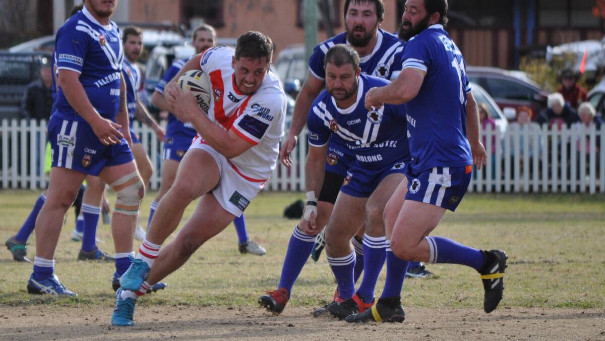 HIT AND SPIN: Mitch Gallagher turns after contact with the Molong defence. Photo: NICK McGRATH