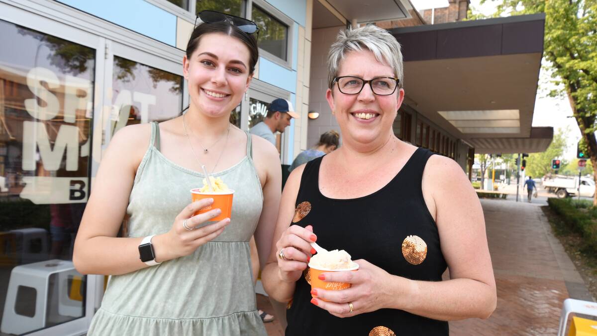 KEEPING IT COOL: Sienna and Michelle Johnson enjoy some ice cream on Thursday, a record-breaking day heat-wise for Orange. Photo: JUDE KEOGH