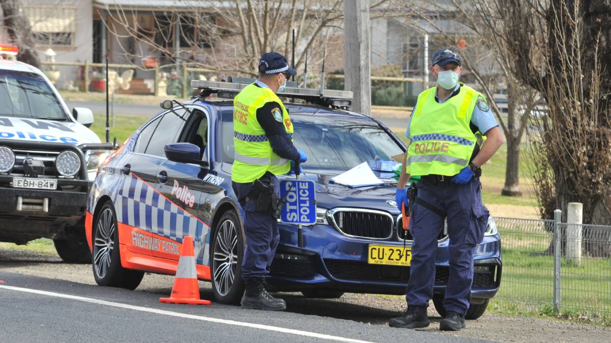 Orange highway patrol officers stopped three men headed for the city to buy a car. All three men weren't wearing masks. Photo: JUDE KEOGH