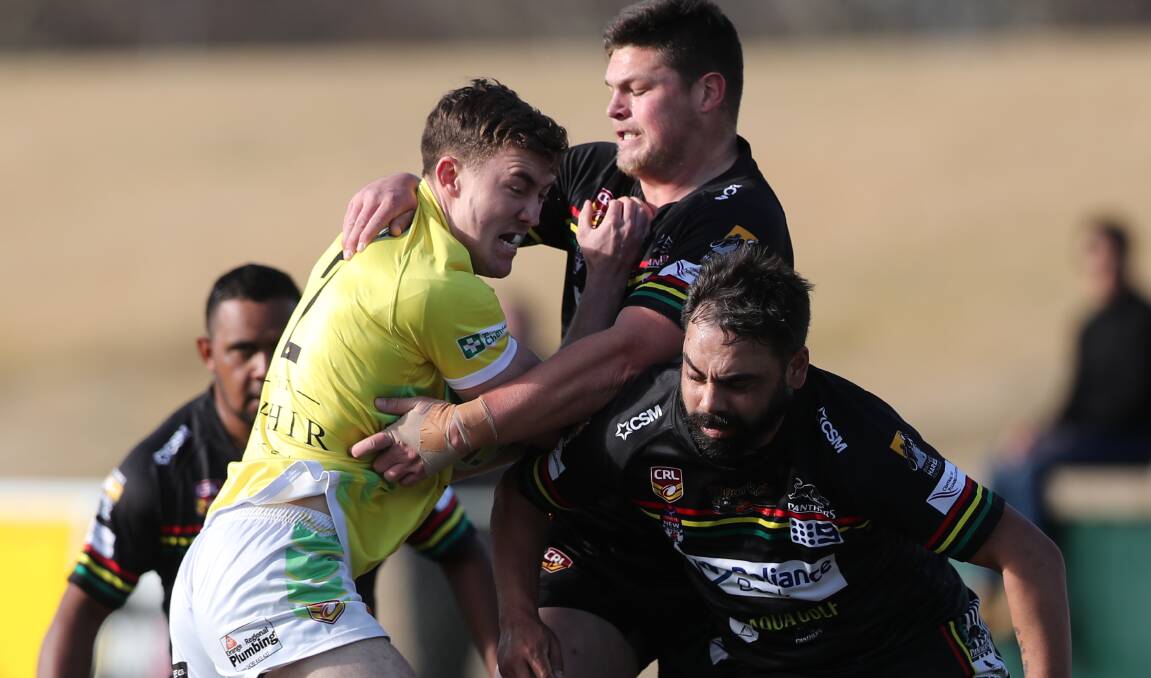 UP THE GUTS: Travis Adelehorf takes the ball up for CYMS at Carrington Park. Photo: PHIL BLATCH