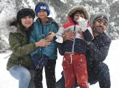 SNOW: Tazeen Ansari, Zayan, Kamran and Hamdaan Ahmed. Photo: JUDE KEOGH