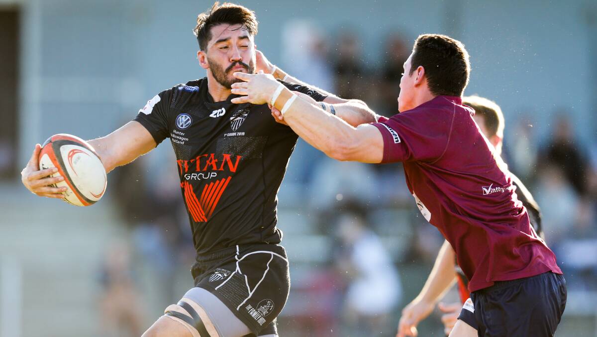GAME-BREAKER: Blacks and NSW Country gun Travis Brooke fends off a would-be tackler in the NHRU premiership. The competition has been cancelled for season 2020. Picture: Stewart Hazell