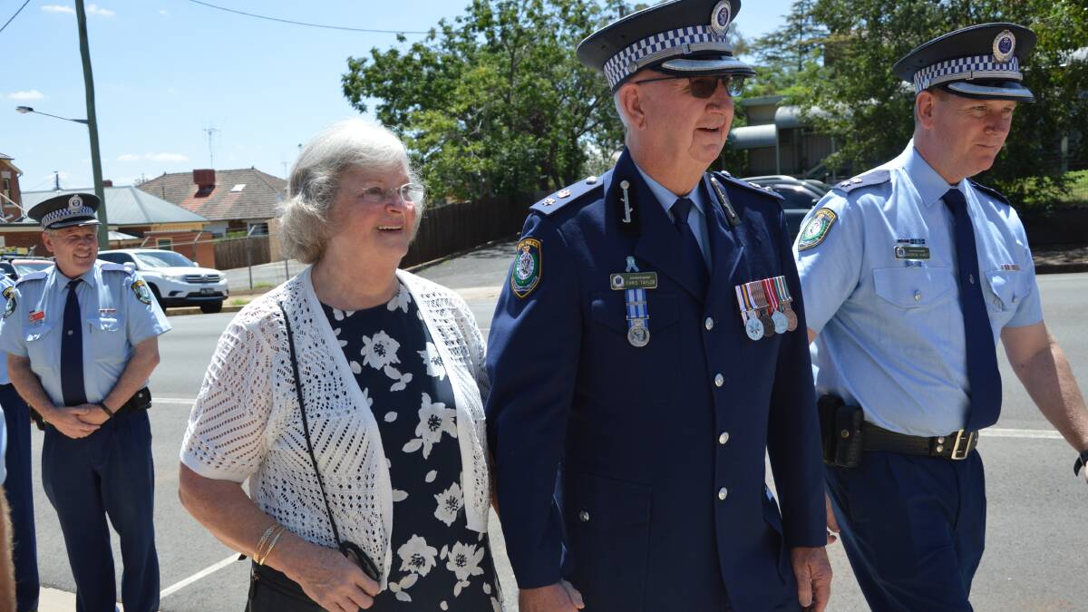 DAY TO REMEMBER: Wife Roslyn later followed Superintendent Chris Taylor through the guard of honour and together they were escorted home in a highway patrol vehicle.