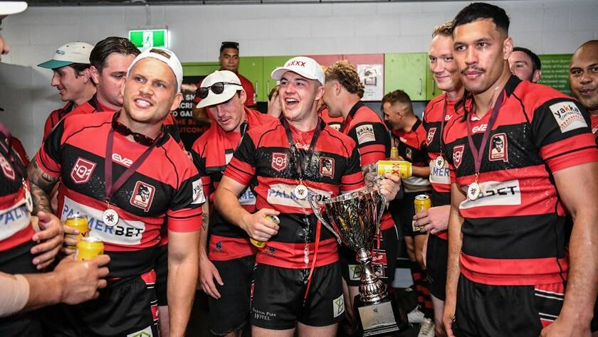 Toby Westcott, with the trophy, celebrates with West Brisbane teammates. Picture by Vanessa Hafner/QRL