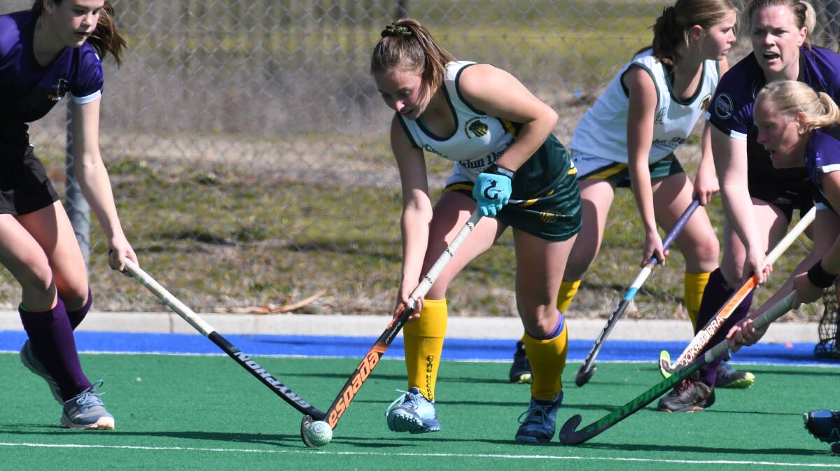 SKILL: Pip Mannix was again one of CYMS best during Saturday's women's PLH decider. Photo: JUDE KEOGH