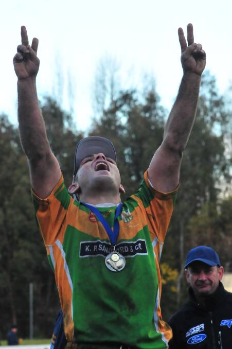 Pat Gibson celebrates the 2011 grand final win with CYMS. Picture by Steve Gosch.