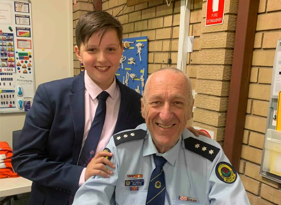PASSING ON THE BATON: Kim Stevens with his grandson Luke, the former is retiring as the Orange City Commander for the NSW SES after 51 years volunteering. 