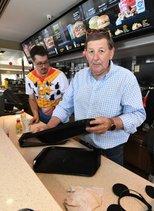 MAC-TIME: Orange mayor Reg Kidd working the counter at the Bathurst Road McDonald's for McHappy Day on Saturday. Photo: JUDE KEOGH
