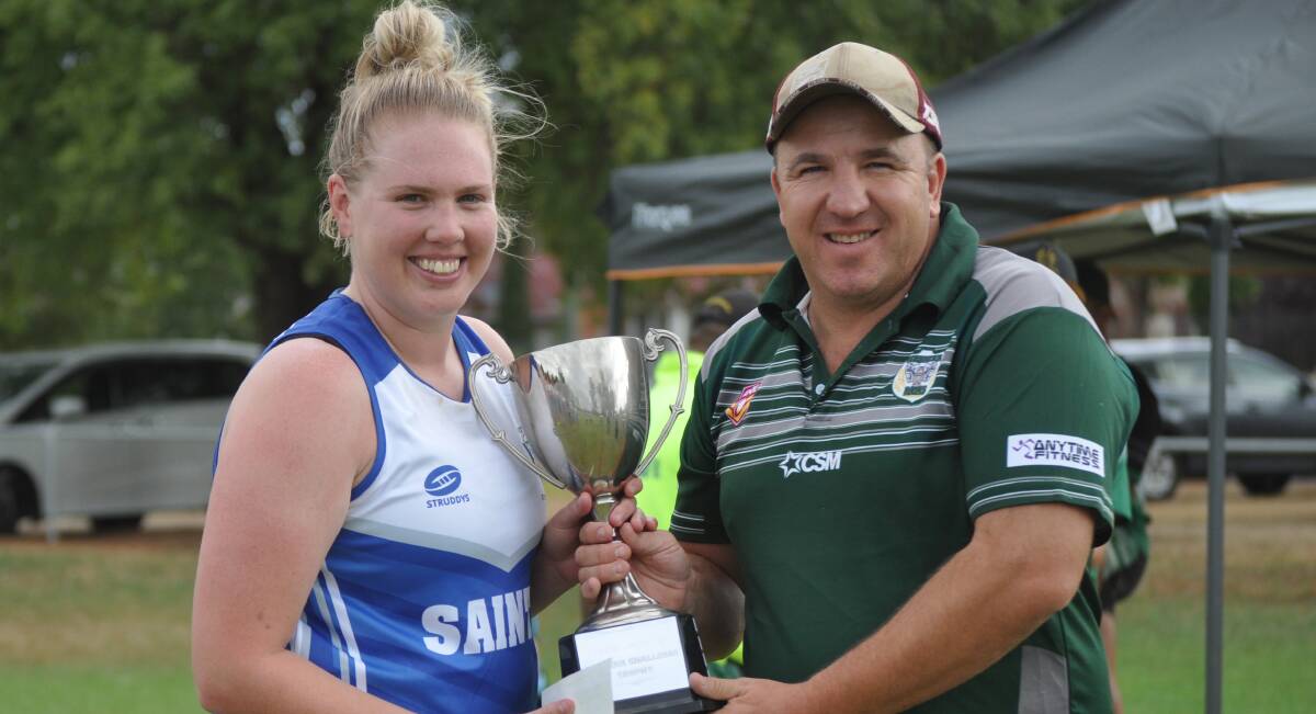 FIFTH CROWN: St Pat's skipper Mish Somers with Woodbridge Cup president Andrew Pull. Photo: NICK McGRATH