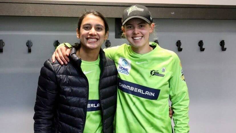 LEFTIES CLUB: Smriti Mandhana and Phoebe Litchfield together in Thunder colours, like they've been a number of times out in the middle this season. Photo: SYDNEY THUNDER