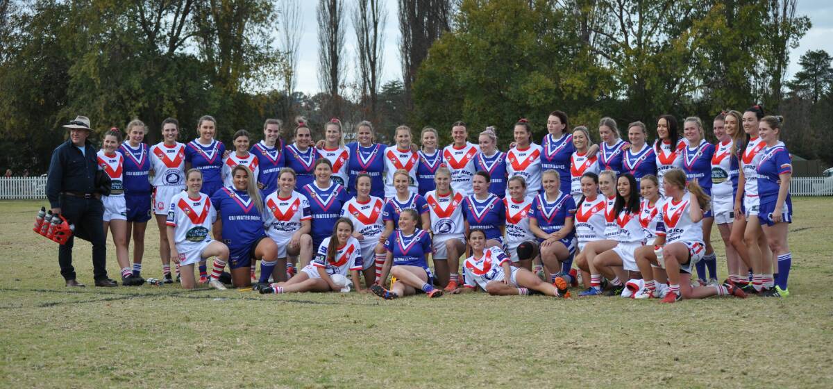 ALL TOGETHER NOW: The Bulls and Rhinos girls gather for a photo after their derby at Molong on Sunday. 