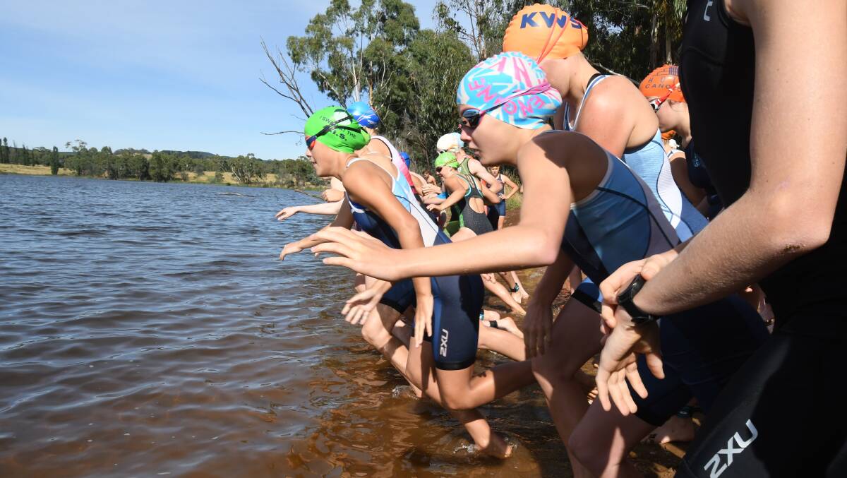 CHILL: Competitors line-up for the start of a triathlon at Gosling Creek this summer, with cooler days making the water a bit more brisk. Photo: CARLA FREEDMAN