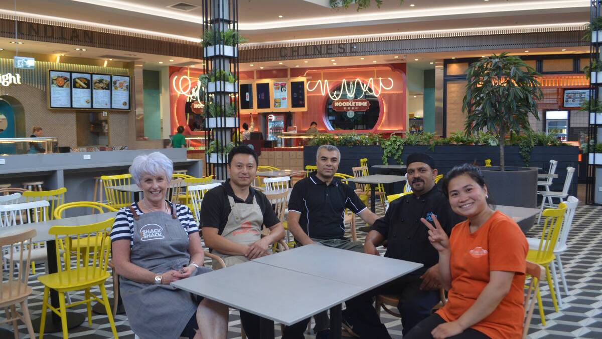 RE-OPEN: Snack Shack's Regina Kearl, Jordan Wang from Noodle Time, Huseyin Kerem from Ispa Kebabs, Indian Delight owner and chef Jose Sebastian and Trang Le from Trang Hue when the food court opened in November. 