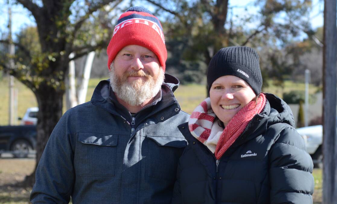 BRAVING THE COLD: Ged and Nicola Nathan on the sideline at Jack Brabham Park on Saturday. Photo: JUDE KEOGH