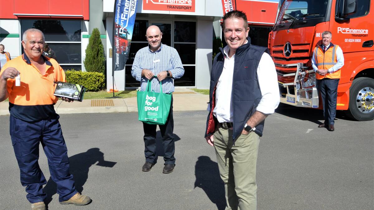 CARE: Longtime Ron Finemore Transport driver Don Lovegrove, North Orange Woolies store manager Mathew Radburn, Bathurst MP Paul Toole and Ron Finemore Transport Orange general manager Jason Bremner. Photo: CONTRIBUTED