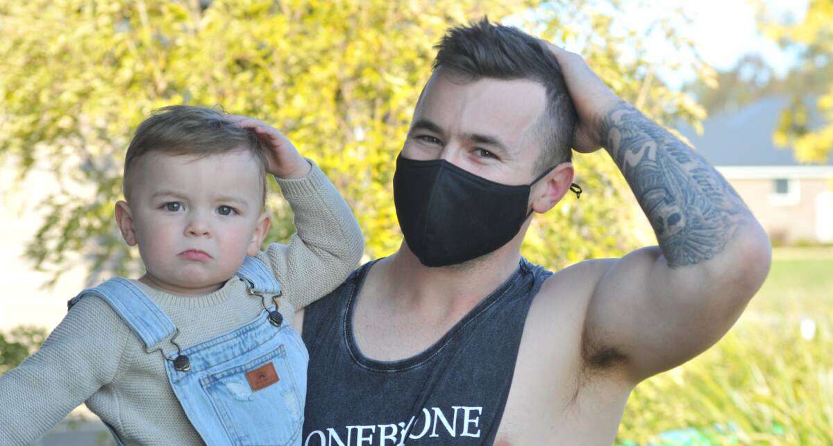 PARTY AT THE BACK: Michael Rothnie, pictured with son Felix, will be growing a mullet throughout September to raise money and awareness for the Black Dog Institute. Photo: JUDE KEOGH