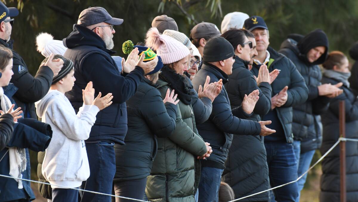 ALL RUGGED UP: Crowds watch on during Monday's final of the under 14s state junior rugby championship at Orange. Photo: JUDE KEOGH